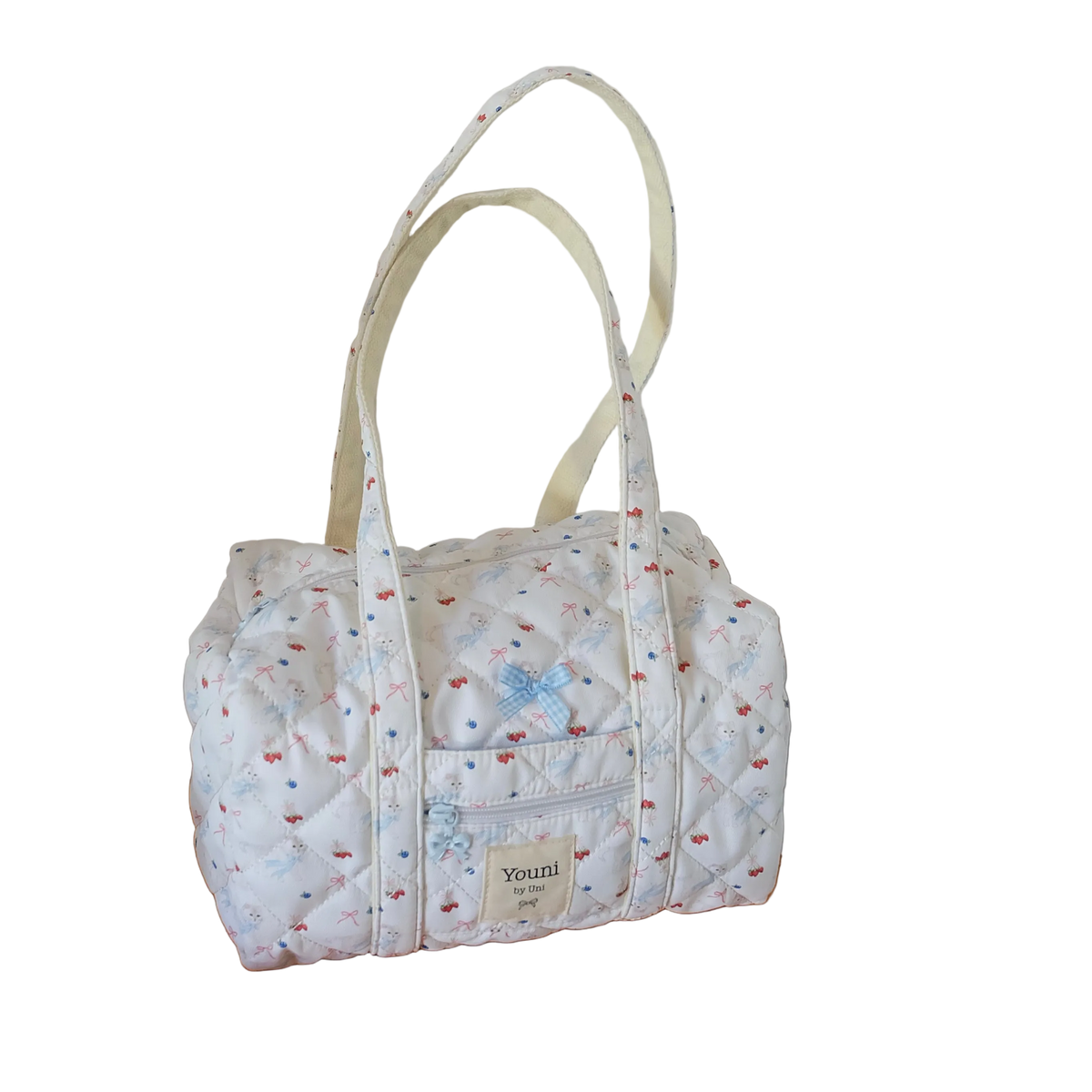 Baby blue summer berries cat handbag with quilted fabric, bow detail and shoulder handles, isolated on a transparent background.
